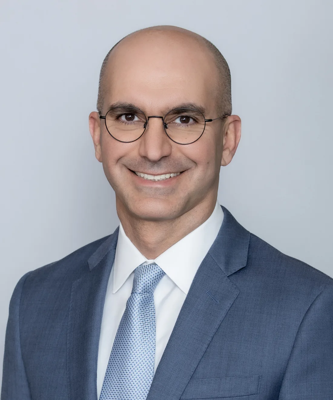 Dr. Kamruz Darabi, triple board-certified dermatologist