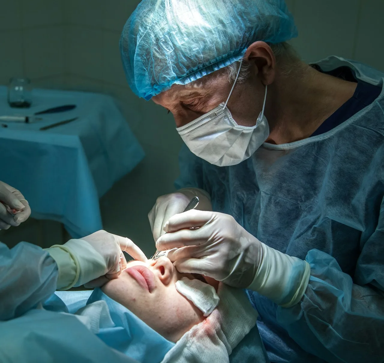 A woman undergoing facial surgery in a clinic setting.